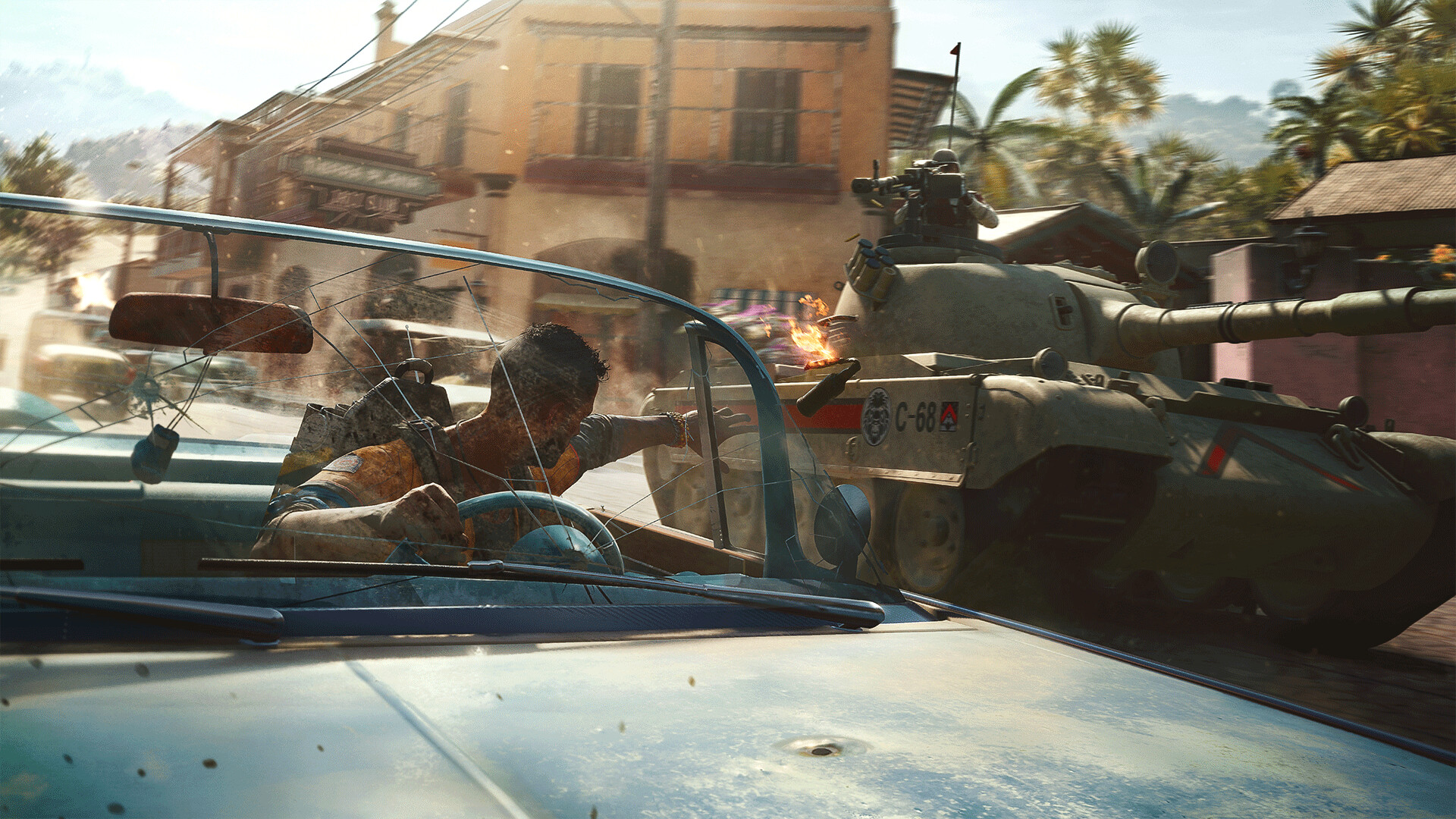 Far Cry 6: a tank firing next to a damaged vehicle in a dusty Yaran street